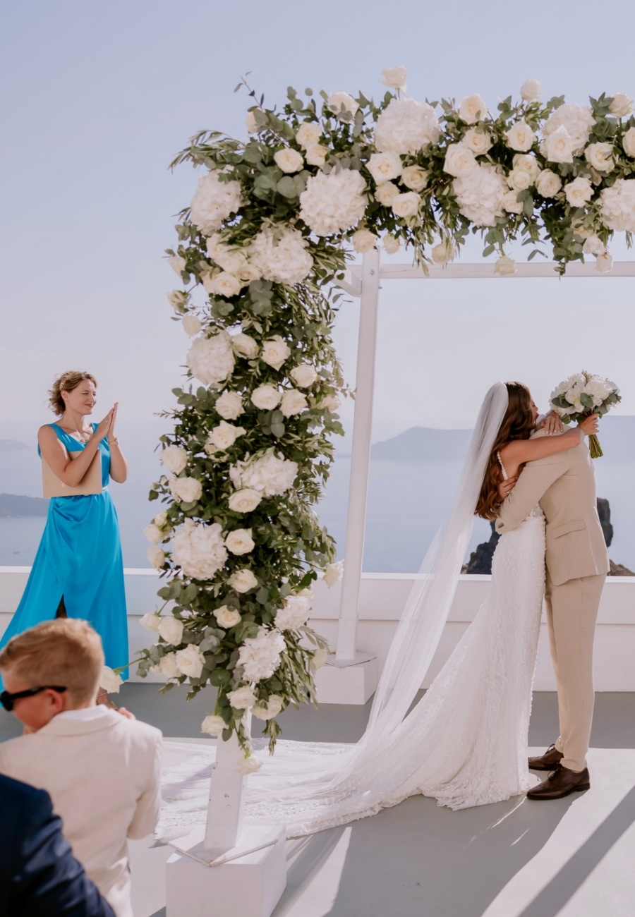 Multilingual wedding ceremony in English and in Russian with celebrant in Santorini, Greece